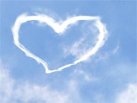 A heart shape in the clouds - A heart shape/love sign in the clouds with a blue sky background, cute..