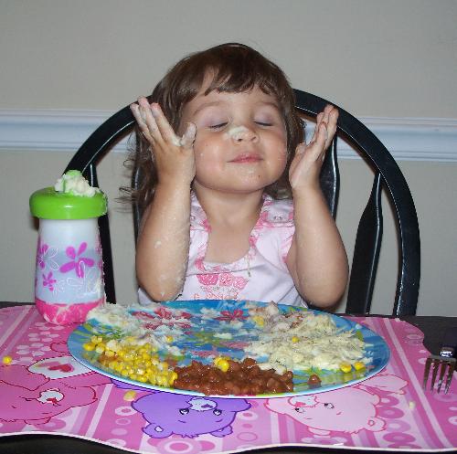 My Daughter - My little two year old. She loves to paint her face with mashed potatoes!