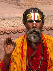 Sadhu - In Hinduism, sadhu is a common term for an ascetic or practitioner of yoga (yogi) who has given up pursuit of the first three Hindu goals of life: kama (enjoyment), artha (practical objectives) and even dharma (duty). The sadhu is solely dedicated to achieving moksha (liberation) through meditation and contemplation of God. Sadhus often wear ochre-colored clothing, symbolizing renunciation.  'Sadhu!' is also a Sanskrit term used as an exclamation for something novel.