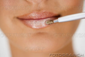lip gloss - woman applying lip gloss