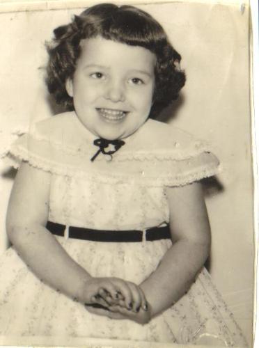 Little Kathy, Miss Bashful - This is a picture of me when I was only two years old, almost 3. This is the first memory, ever, of my life, that I have ever recalled. At least that I am aware of, that is.  In fact, I recall that day I had that photo taken, probably b/c it was a big deal and I was in the spotlight! A nice, cheerful older man took my photos and he kept telling me how cute, sweet, and pretty that I was, and just making me smile made him happy. I recall sitting on the piano bench that he covered with a colored rug. It was a fun experience and back then, it was so cool to just SEE photos in black and white.   By the way, the dress I had on in the picture was pretty colors of pink with  tiny flowers all over, then it had this see through/sheer layer that came down over the under layer that I think was lighter pink.