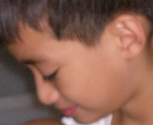 my son - A picture of a young child engrossed with his craft.