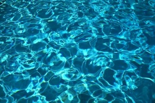 Water ripples - Some pretty water ripples in clear blue sea water. You can probably find something like this on a clear, sunny day.