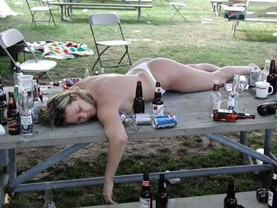 A drunk woman on a table. - A funny image of a woman being drunk on a picknick table. I think she&#039;s sleeping lol.