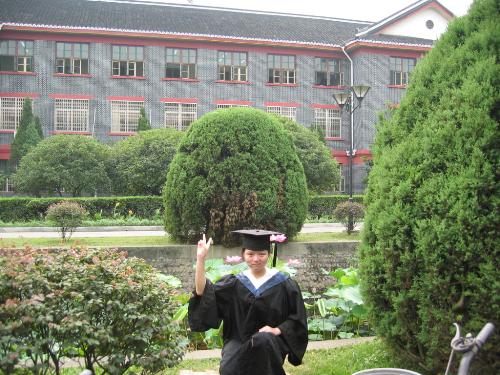 When I graduated from college last June - Last June, I graduated from the West China Medical Center of Sichuan University. This photo was taken by the side of Pond Lotus. And the background is the third teaching building.