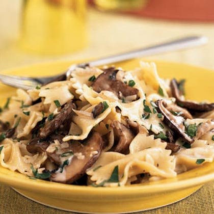 Farfalle with Creamy Wild Mushroom Sauce - Lightly coat bow tie pasta in a smooth wine sauce flavored with meaty wild mushrooms and garlic.