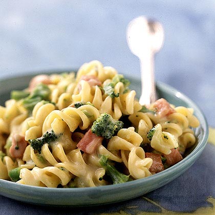 Rotini and Cheese with Broccoli and Ham - Go one better than mac and cheese by using corkscrew pasta and stirring in chopped ham and broccoli. Dijon mustard adds a punch to the creamy cheese sauce.