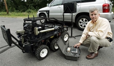 This is the Man.. Brian Hart - Black-I Robotics founder Brian Hart, whose son was killed during an ambush in Iraq in 2003, poses in Tyngsborough, Mass., Wednesday, Aug. 22, 2007 with a six-wheel cost-effective robot that his company designed to protect troops and perform certain risky missions.