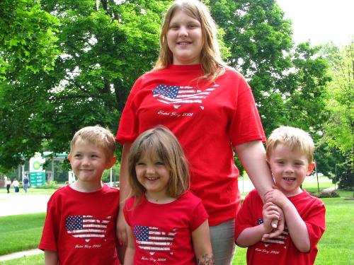 Christina, Logan, Isabella and Brody on Memorial D - My almost 6 yr old triplets any my 16 yr old on Memorial Day. Christina actually sang the national anthem at the ceramony following the parade.
