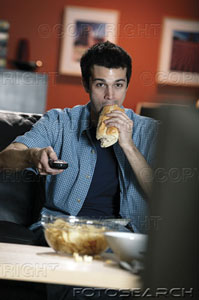 watching tv - man eating and watching tv