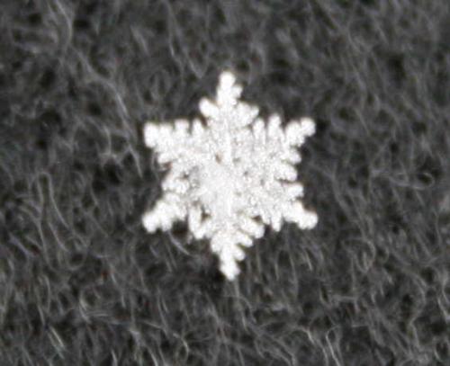 snowflake - A snowflake on a black background