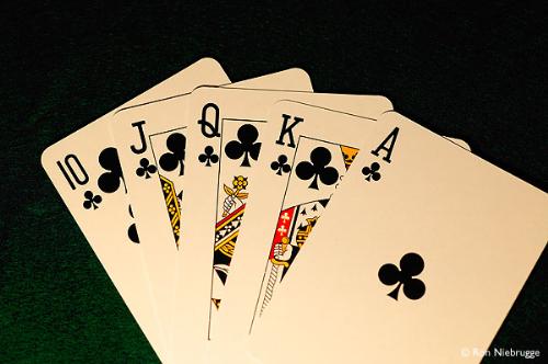 Royal FLush - A picture of some poker cards, in this case he's holding a royal flush, the highest achievement in poker.