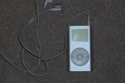mini IPod with headst - photo of silver mini IPod with headset