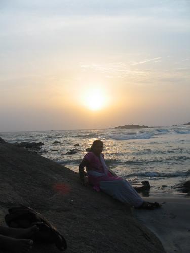 kovalam beach  - this is a sunset photo of me sitting on a big rock just below the light house.