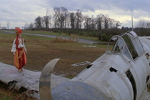 Christian Bale - Empire of the sun film with Christian Bale walking on the bottom of an empty swimming pool filled with dead tree leaves.