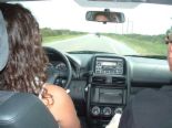 Driving down the road - Driving down the intersate. In a car looking forward. taken from the backseat.