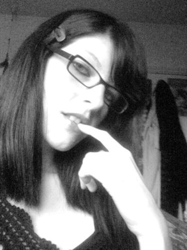 Me! - Taken with cam on cell/mobile. In me bedroom Yea... lol  Some people say I look like Milla Jovovich. o.o?
