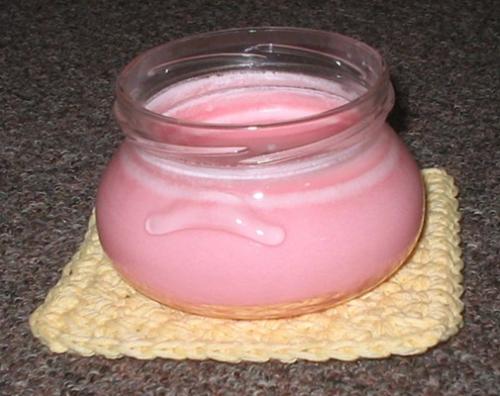 Candle on a Coaster I Made - This is a wonderfully smelling candle that I bought from a friend that makes her own. It is sitting on a coaster that I crocheted.