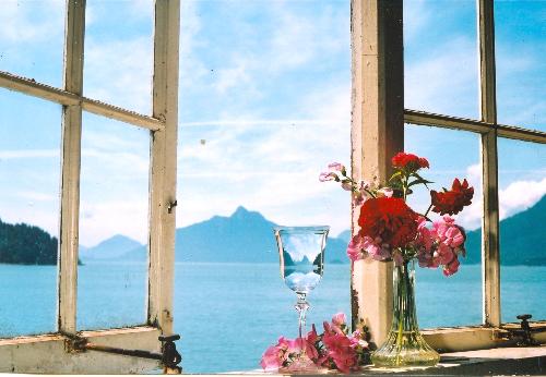 window - a window sill with flowers lookin out over Howe Sound,British Columbia,Canada