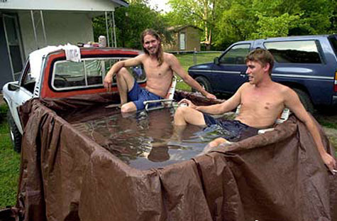 friends truck pool - these two guys got hot and they took a chill behind the truck.