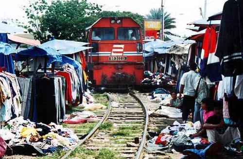 Only in Indonesia - It a train moving through a small market in Indonesia.