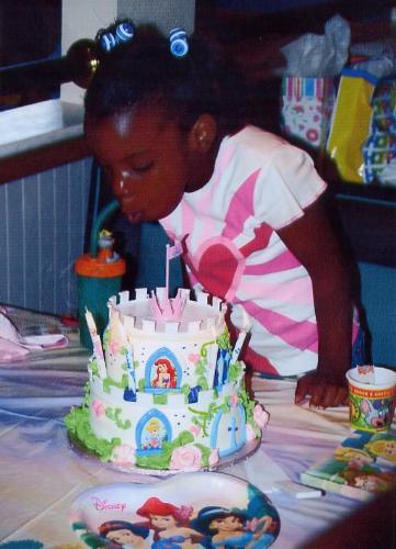 Birthday Cake - This picture is all about the cake. It was two layers with extreme detail. The cake has the Disney princesses on them in cake icing. I spent a lot of money on this cake, but I think it was worth it! My daughter loved it and was very surprised, plus everyone complimented the cake. No one thought it was real!