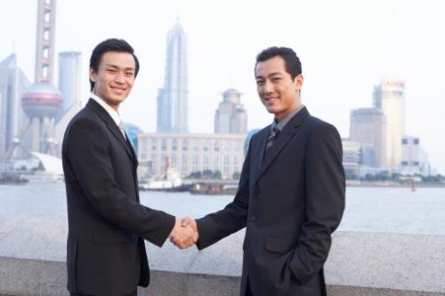 Making new friends - two gentlemen shaking hands