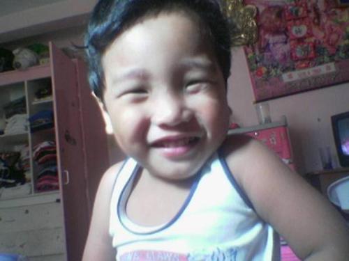 smile! - he's a camwh0re! he loves to smile and laugh..