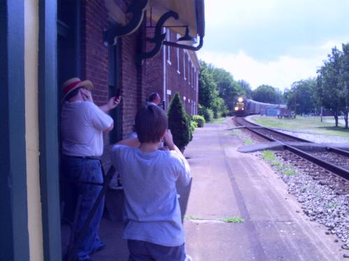 Stuart watching a train come through - Stuart was standing out by the tracks when this train was coming through so Amanda got a picture!!