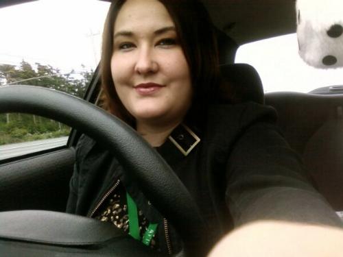 Picture of me in my car. - This is a personal picture of myself, taken with my cell phone in June 2008.