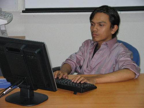 My Life And Computer - An old photo of me concentrating on my job in front of a computer. Better make money using computer.
