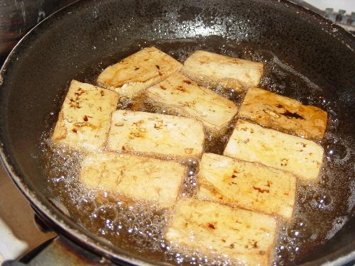 Fried Tofu - Tofu is a versatile food and very healthy too. I usually add it to adobo (pork or chicken) as accompaniment to gruel, or sometimes I eat it as is, dipped in vinegar with soy sauce, crushed garlic, diced onion and scallions.