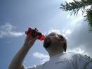 Slurp, slurp! - Picture of guy under the clear blue sky drinking out of a bottle
