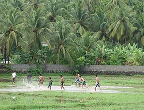 Playing foot ball in rain (Picture from kerala, In - Playing foot ball in rain (Picture from kerala, India)