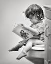 &#039;im a big girl now&#039; - Picture of a little girl on the potty reading a book