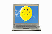 laptop with smile face - photo of laptop with smiley face balloon on screen