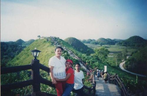 me & my mom @ chocolate hills 5 yrs. ago! - Chocolate Hills can be found in the province of Bohol in the pHilippines. You can see hundreds of hills on this place. It is really a God's creature. a nature that you would really love when you see it. It is presently nominated on the new7wonders.com and it now ranked #4. Philippines has the best view and places to travel. vote now!