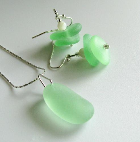 Seafoam Green Sea Glass Necklace and Earring set - These 2 items will go into my Etsy.com shop sometime later this week, as seperate listings. Each earring is adorned with two soft seafoam green pieces and accented with a polished shell bead, in ivory/white. The earrings are approx 3/4' in length.  The size of the seafoam piece of sea glass on the necklace is approx 3/4' and hangs on a 16' sterling silver chain