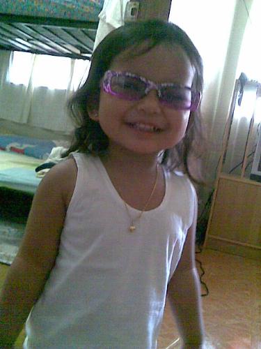 my pride and joy - taken after playing outside the house.She was so eager to wear her sun glasses
