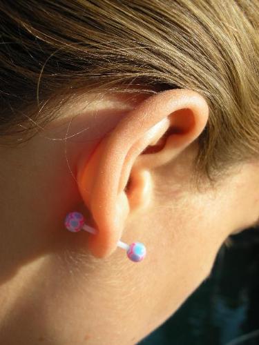 14G Teflon (PTFE) Ear Barbell - This is one of my new non-metal ear barbells. I had to stretch my lobes to wear these, but it wasn't bad. As you can see here, my ears are no longer infected and disgusting.