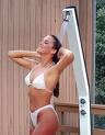 so fresh and so clean - A picture of a tall girl under a outdoor shower in white bikini and running her hands through her hair with a smile so fresh and so clean - A picture of a tall girl under a outdoor shower in white bikini and running her hands through her hair with a smile