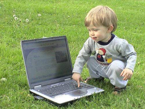 internet child - the picture shows the extent to which the internet and computers,spread in todays world...