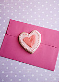 love - photo with valentine heart cookie on envelope