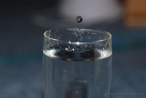 Water Drop in the Air - I just played around with my camera and took some photos of water drops diving in a water filled glass and this one was shooten a bit too soon ^^ but it turned out nice anyways
