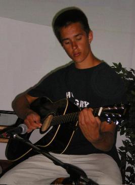 Mike on guitar praising the LORD! - Here is Mike playing guitar in the youth band at church.