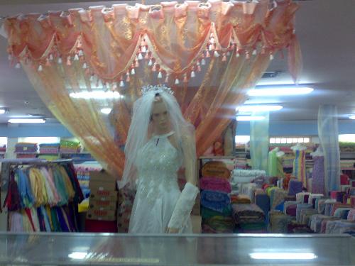 shopping - beautiful wedding gown in one of the department stores downtown