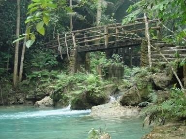 Matutinao River - Matutinao River is where the famous Kawasan Falls of Badian, Cebu lies. It is your companion during the 30-minute luxurious trek from the main road to the waterfalls. I say 'luxurious' because one doesn't need to know rapelling, climing or any of those stuff to reach the waterfall. One can walk as he looks around to appreciate the green. I do not recommend this to those who are up for a more challenging adventure. This one more tourist-friendly. Locals have built bridges and large trails with a reasonable entrance fee of 1o Philippine Pesos. Sadly, as we go closer to the main waterfall, more food stalls color the area making Kawasan more commercialized than natural. Cottages would cost around 300 pesos and up. To sit on a plastic chair with a matching Coca-cola-marked wooden table would cost 200 pesos. Food is also expensive. I'd rather have mine home-cooked and packed for the trip. As a nature-lover, I can only suggest that store-owners paint their stores brown (as in the color of the woods) to make them look natural than eyesores.