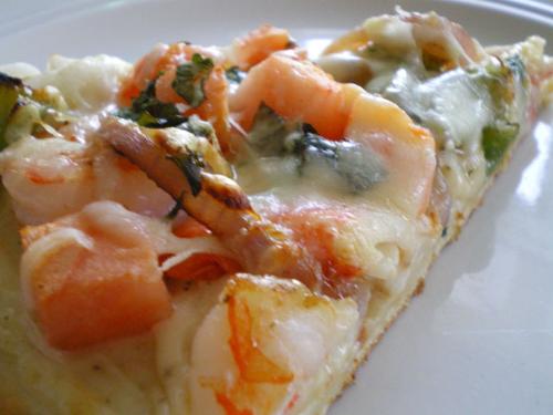 Seafood Pizza - Two of my greatest things put together. I love pizza and adore seafood, so it is the perfect combination. Here's a picture of some seafood on a slice of seafood...hold the onions.