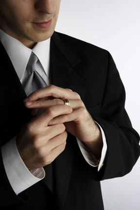 A man pulling off his ring  - A man pulling off his ring.. 