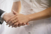 marriage... - a couple holding hands in matrimony